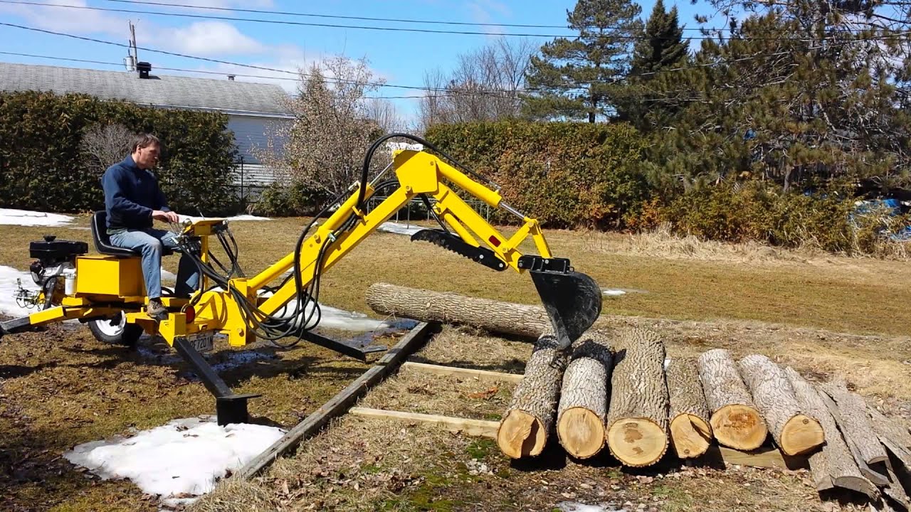 Backhoe - Handling oak logs