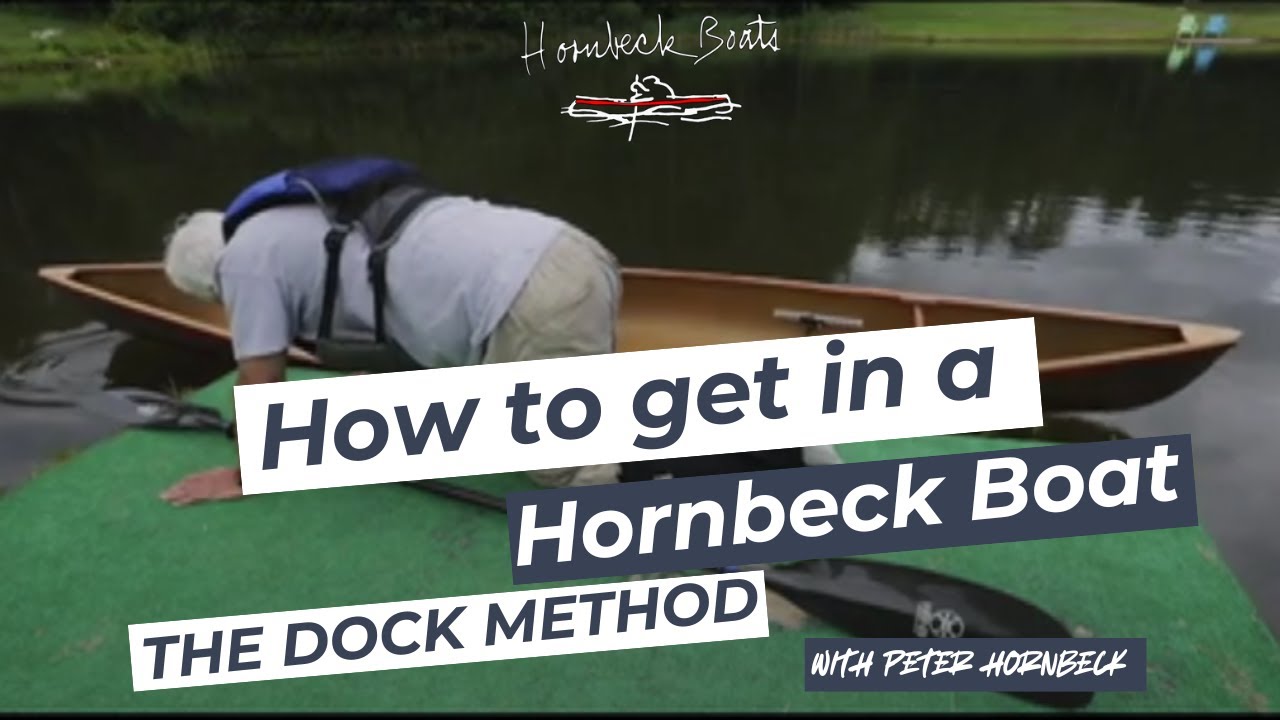 Hornbeck Boats Getting out of a pack boat onto a dock.
