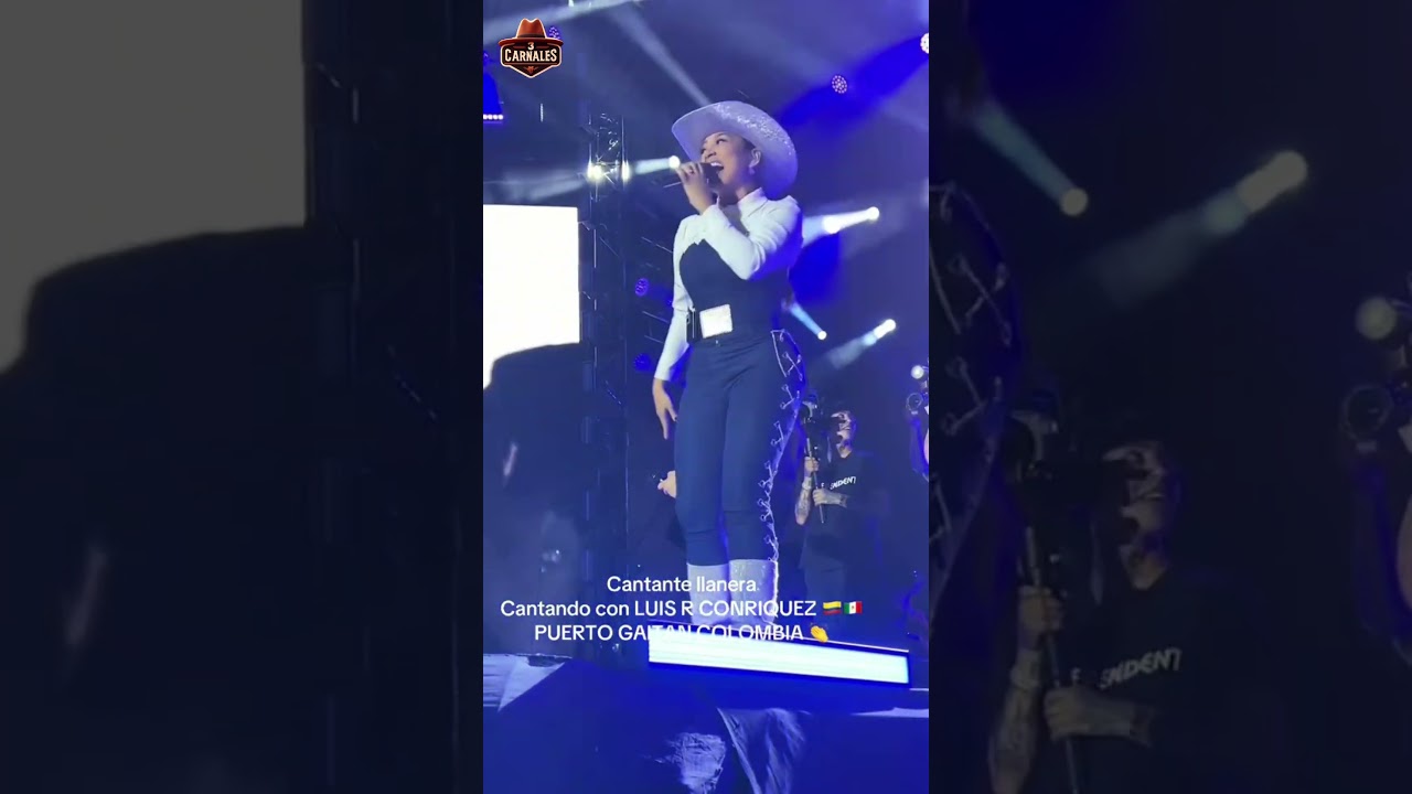 Luis R Conriquez cantando bien serio