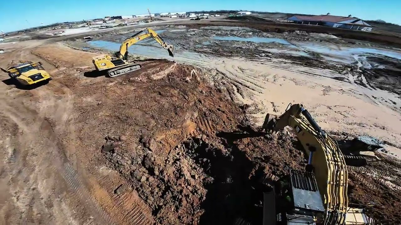 CAT 374 and CAT 352 Hogging Dirt Drone Flyby