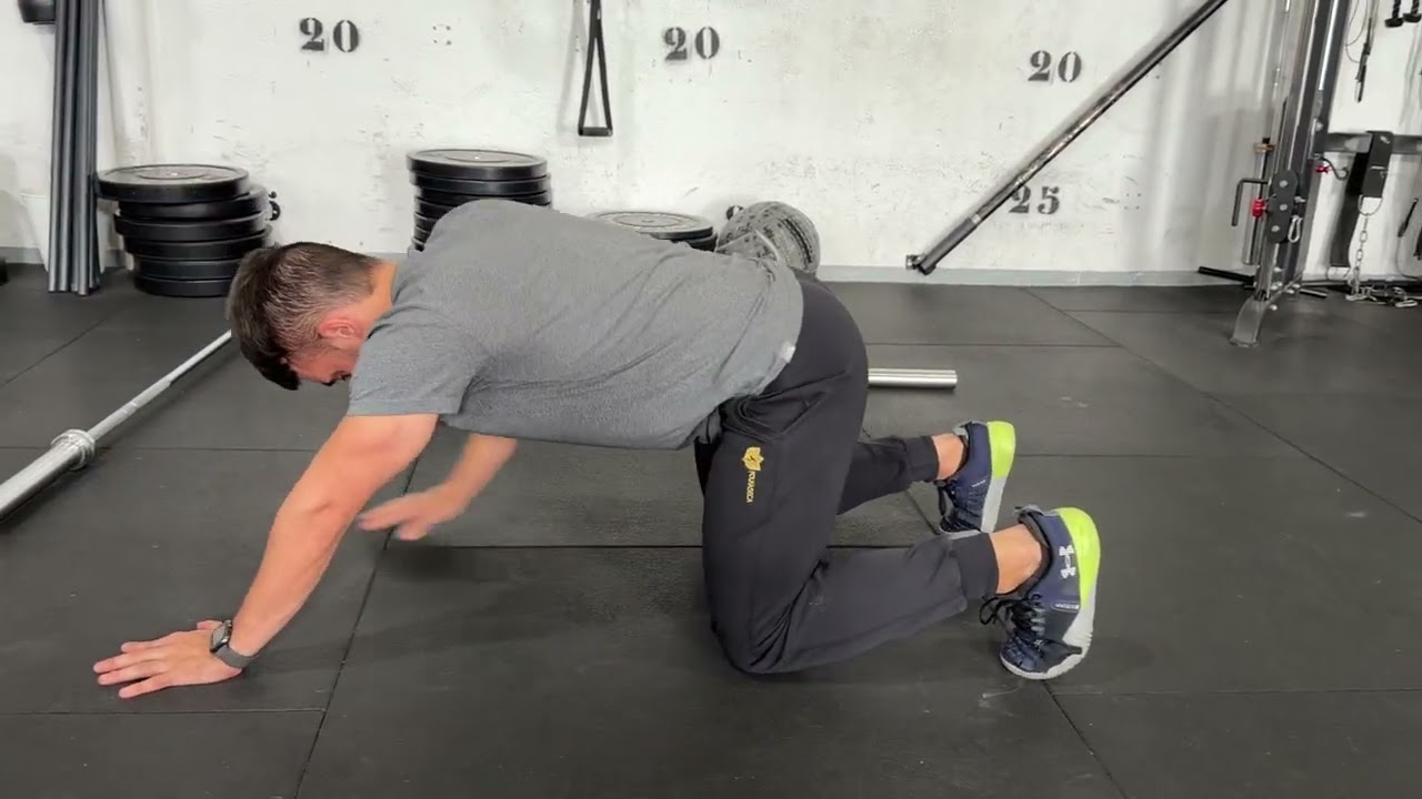 Rock back to deep squat
