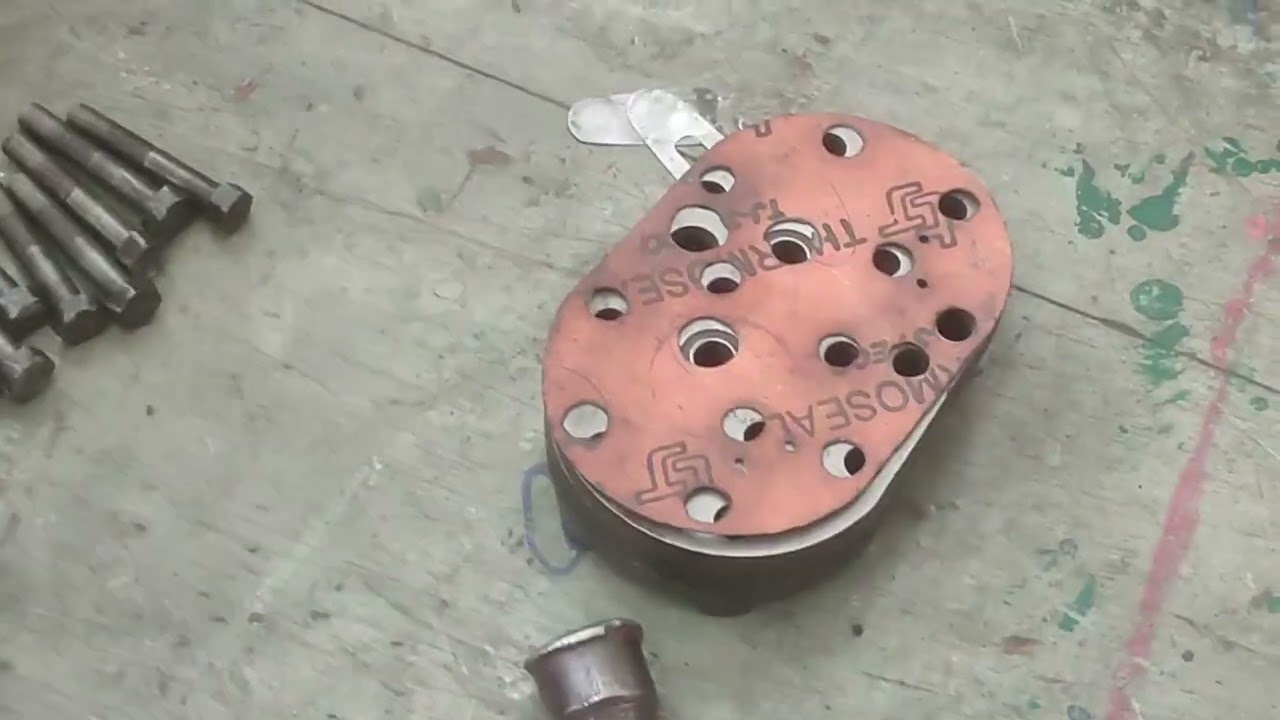 Dismantle of single acting double piston open type Reciprocating Compressor