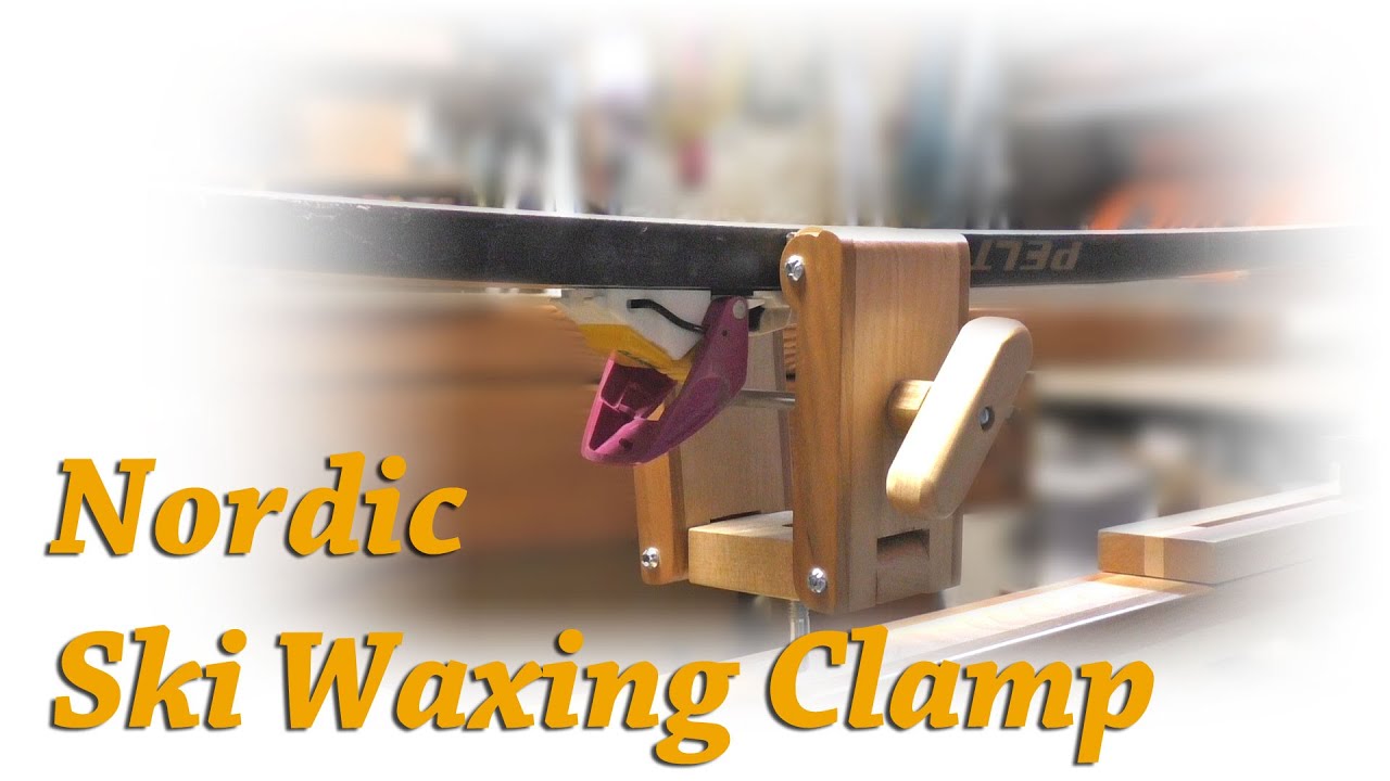 DIY clamp for attaching a ski to Nordic ski waxing stand.