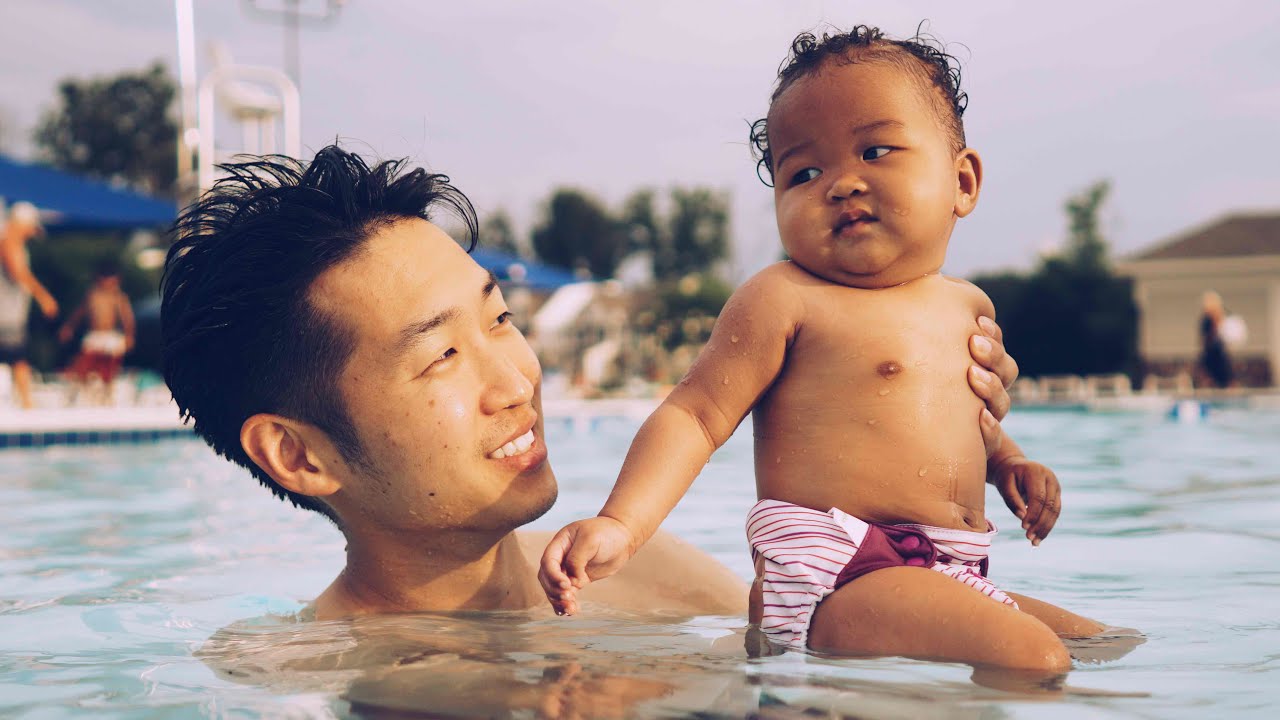 BABY GIRL'S FIRST SWIM
