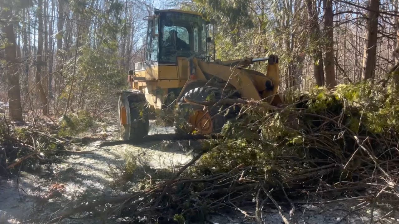 Clearing roads after massive ice storm destruction