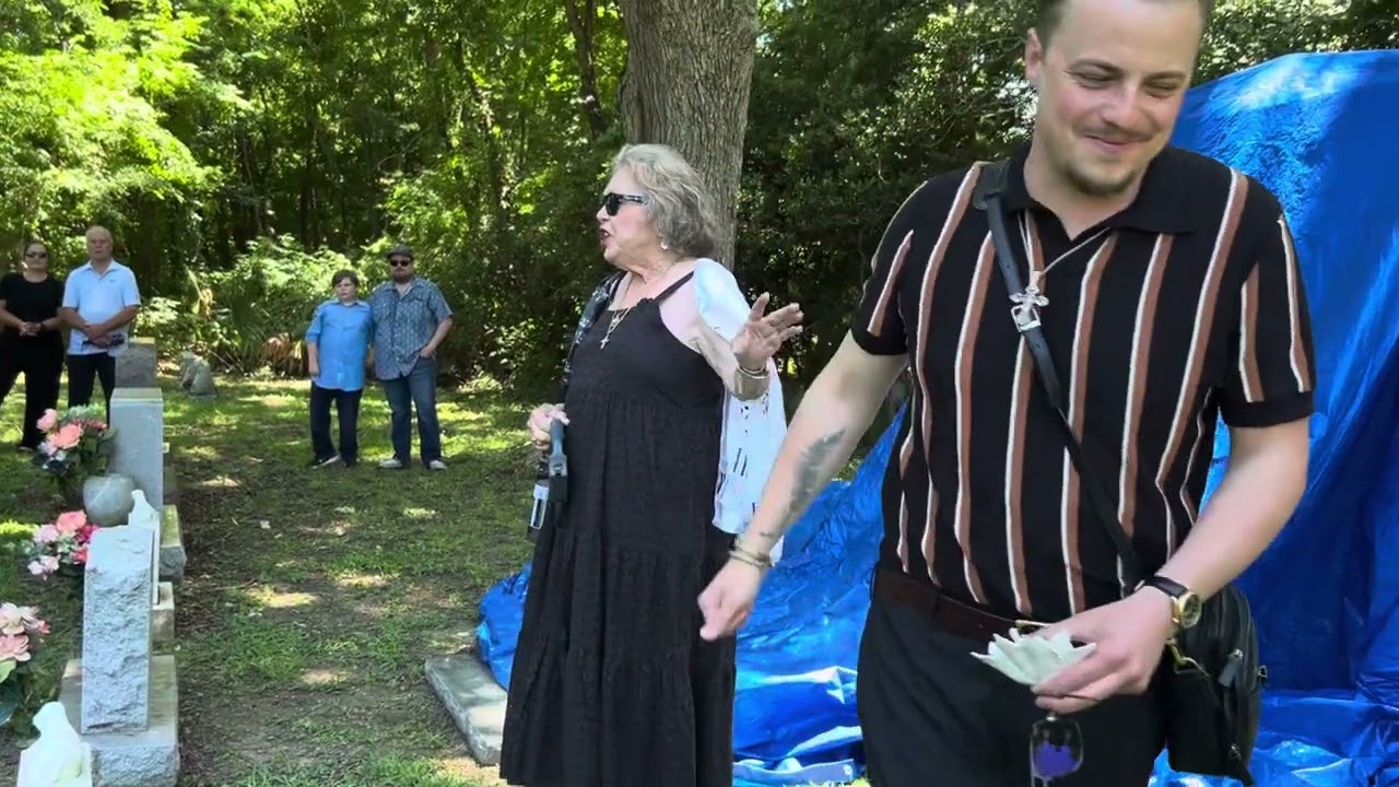 Judith Lewis talking to the crowd at the cemetery June 8, 2024
