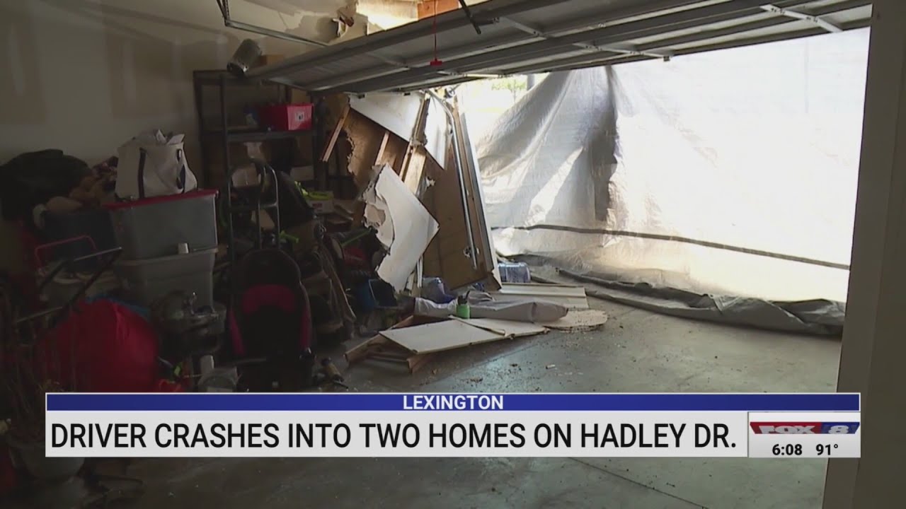 Driver crashes into two Lexington homes