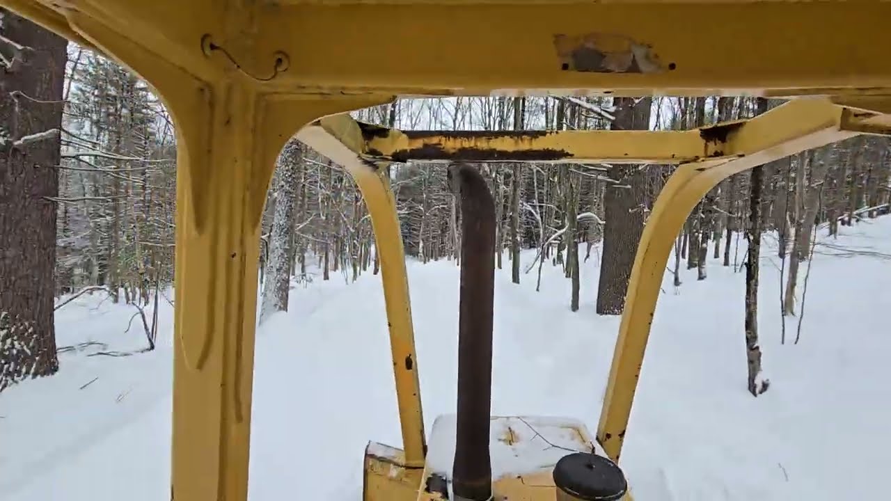 Plowing snow with the John Deere 450G dozer part one