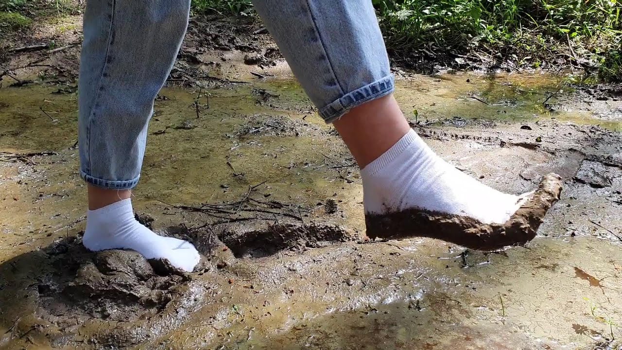 Muddy white socks, white socks in mud, dirty white socks, socks in puddles walking (scene 526)