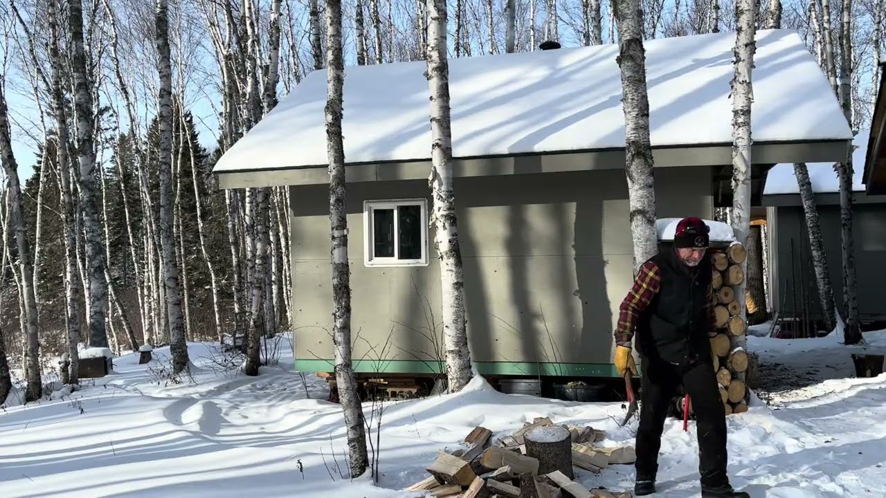 splitting firewood at the trapline cabin, Canadian wilderness, Northwestern Ontario