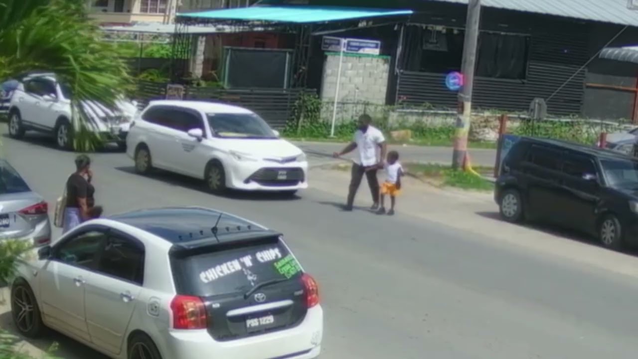 Caught on Cam: A Parent's Worst Nightmare - Driver Nudges Parent with Child