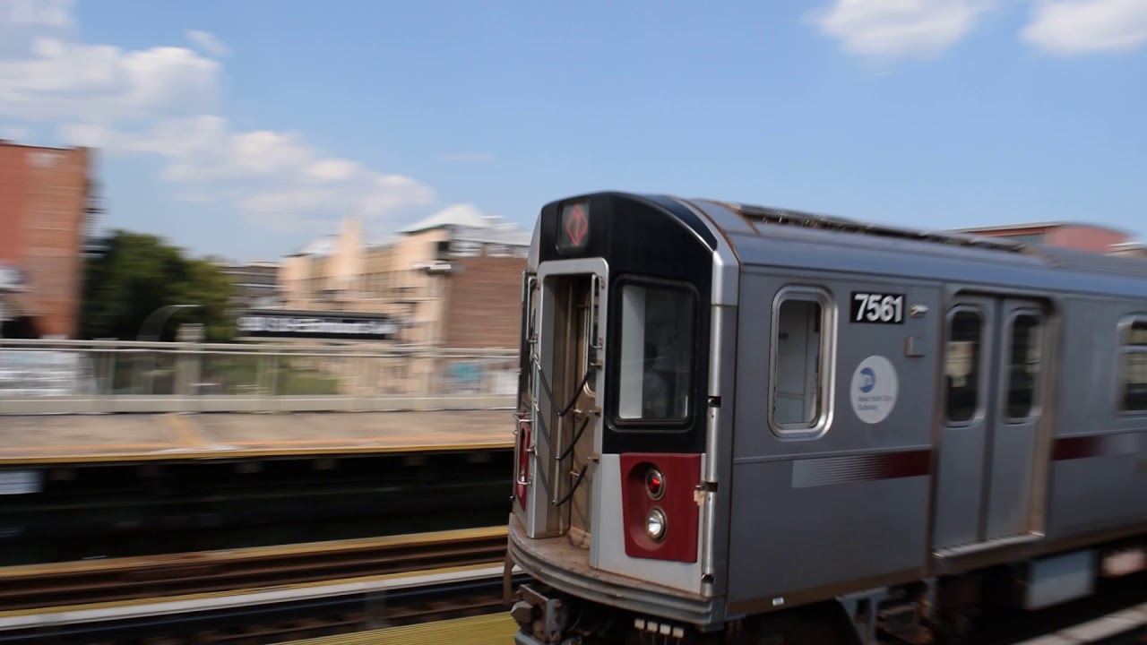 Flushing-Main Street-bound Converted R188 (7X) train bypassing 90th Street-Elmhurst Avenue