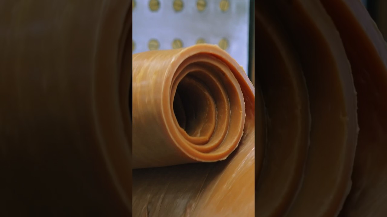 The process of mass-producing rubber bands. A rubber band manufacturing factory in Japan.