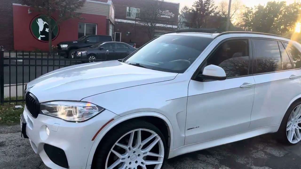 2017 BMW X5 drive50i m sport on 24s 24 inch rims wheels white on white