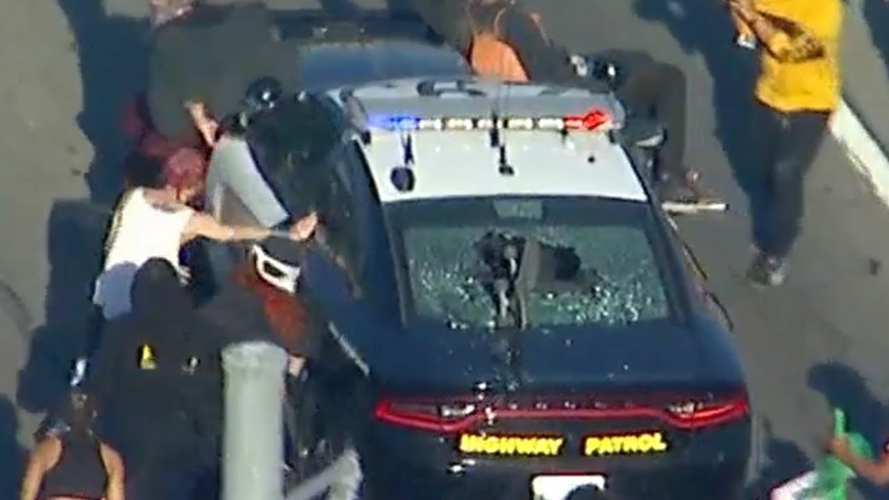Protesters Destroy Police Car In riot
