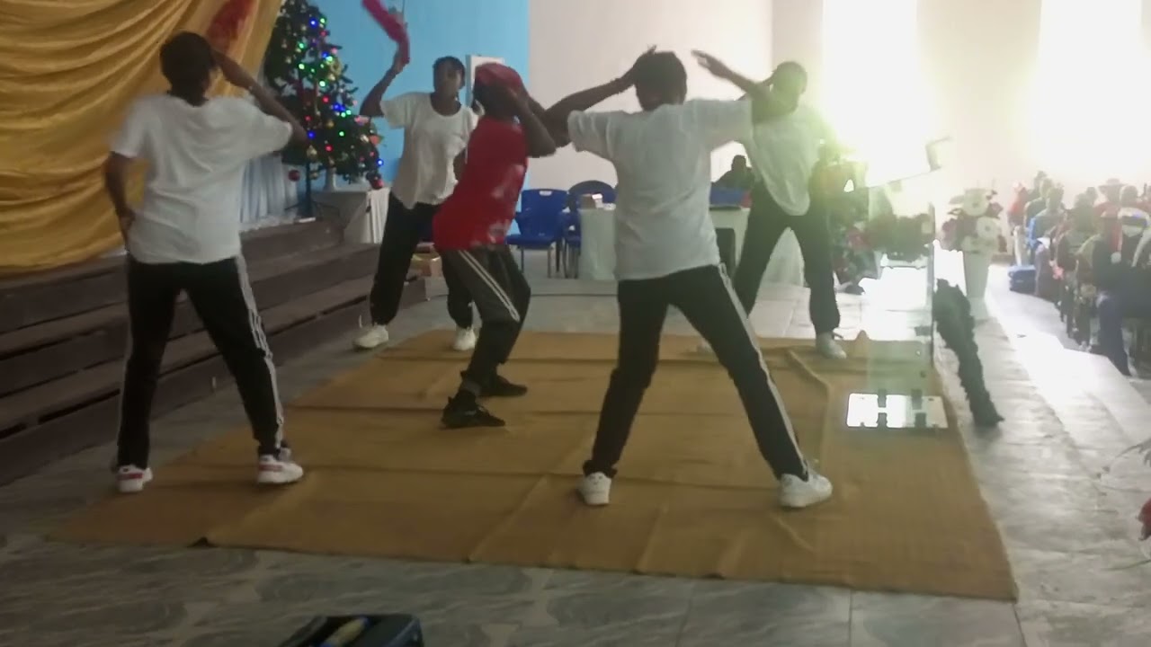 Idara leads her dance group at AFCS Carols 24