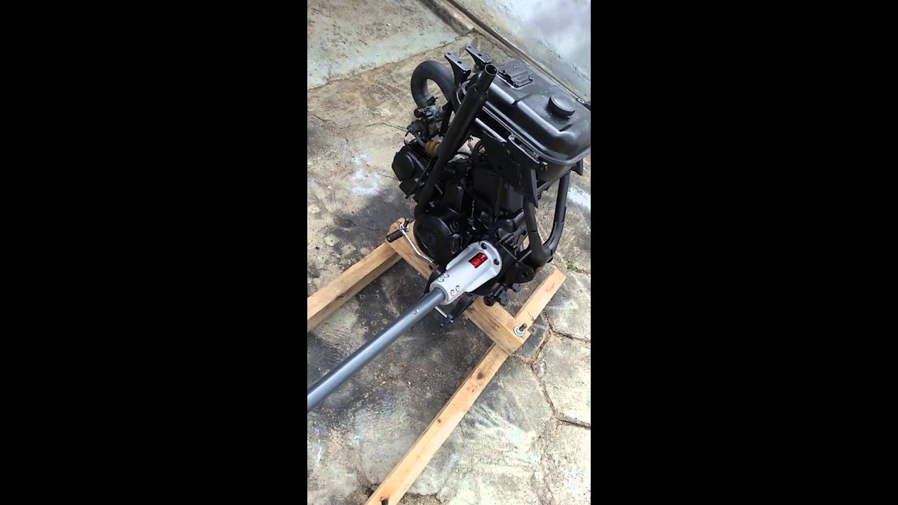 Motor de biz 100cc adaptado pra barco