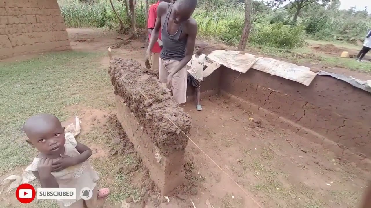 Building a house using mud in an African village.