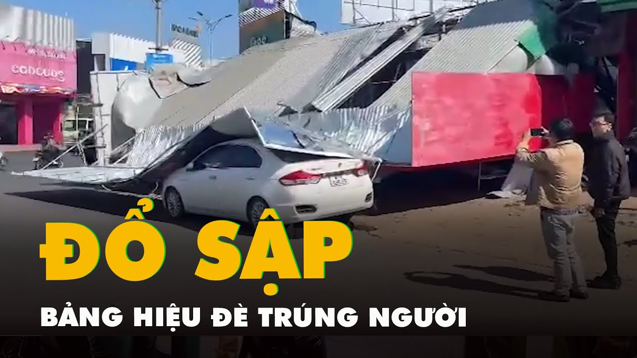 Vừa mua xong điện thoại, người phụ nữ bị bảng hiệu tiệm điện thoại sập đè trúng