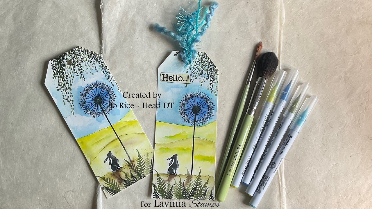 Pipin admiring the Fairy Dandelion on a watercolour tag by Jo Rice #laviniastamps