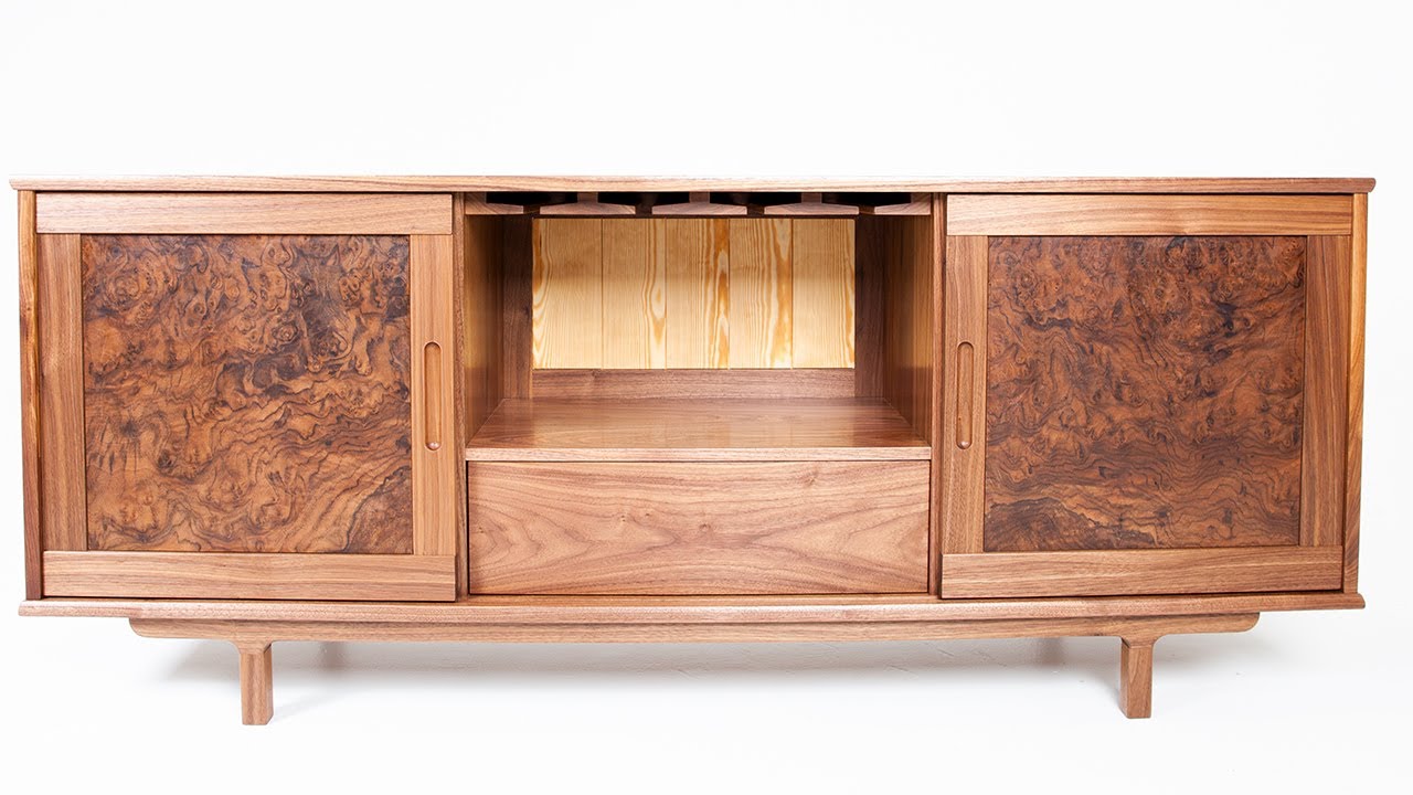 Walnut credenza with sliding doors and walnut burl veneer