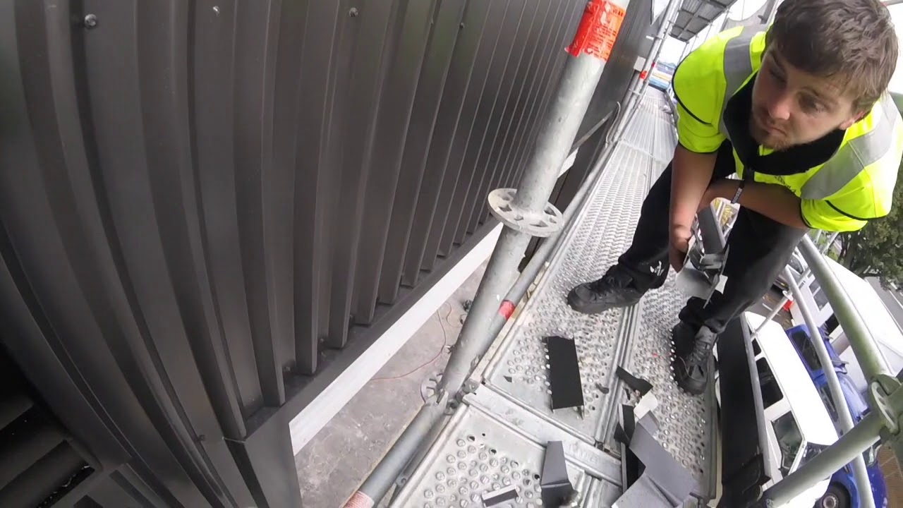 Metal wall cladding head flashing.