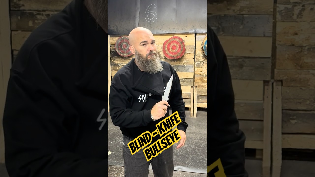 World Champion Knife Thrower hits the bullseye without looking