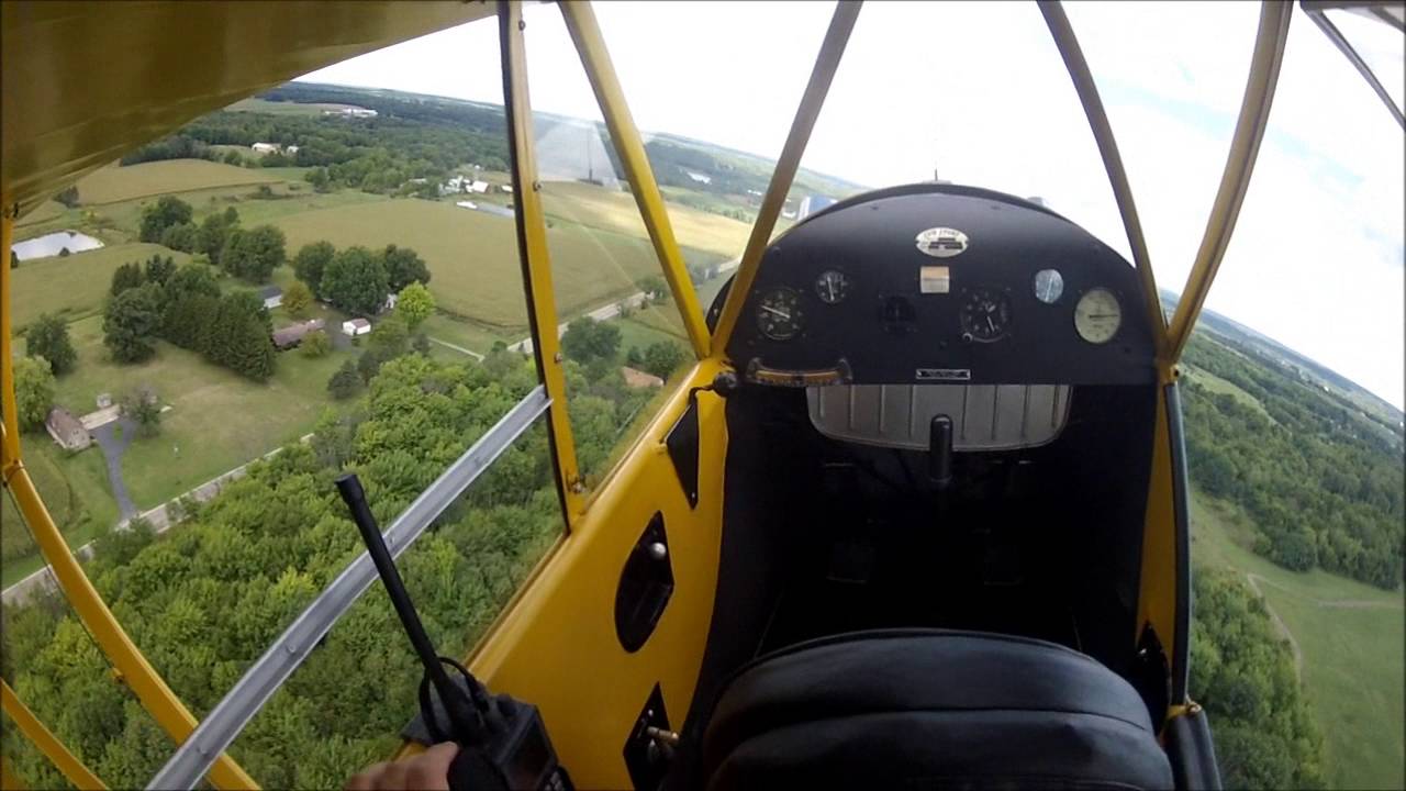 Takeoffs and landings in a 1940 Piper J3 Cub