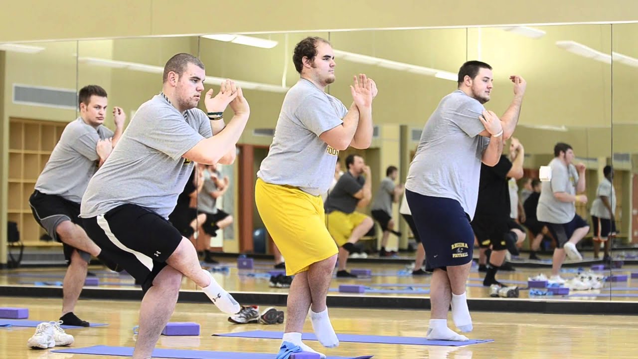 UW Oshkosh football players do yoga