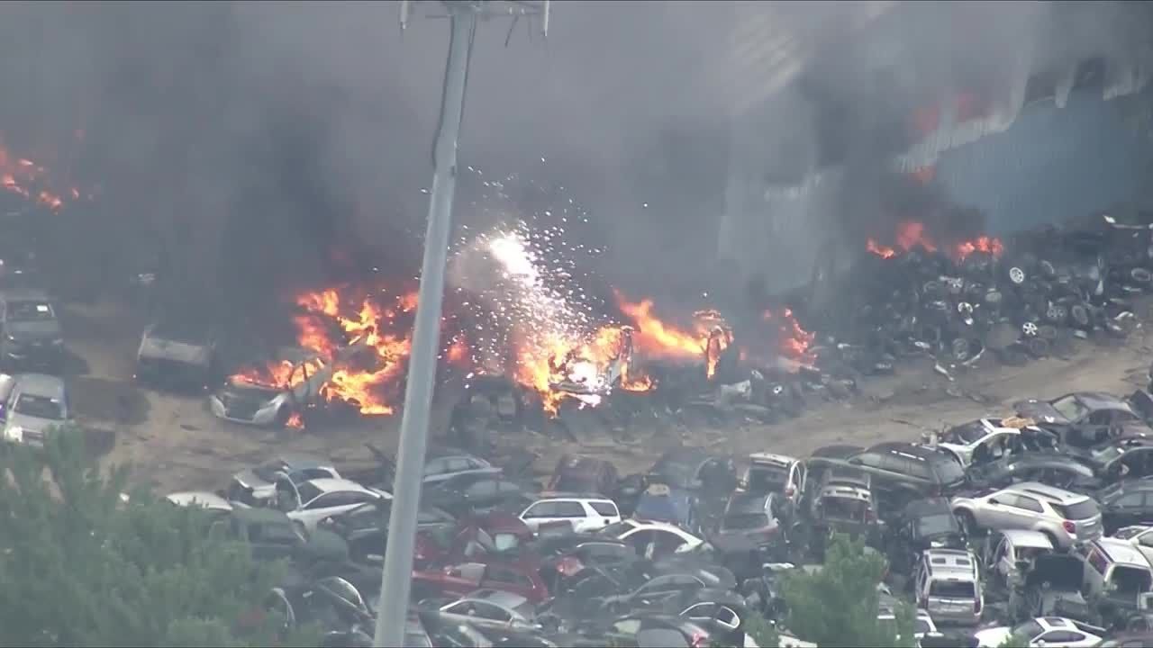 Sky5 over explosions, roof collapse during junkyard fire