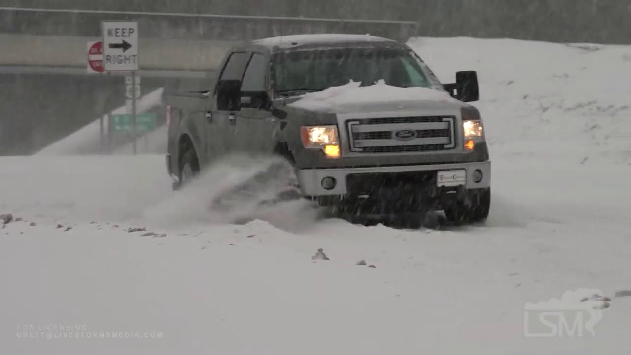 02-17-2021 El Dorado, AR - Heavy Snow, Cars Stuck on Spinning Tires, People Riding 4-Wheelers on Str