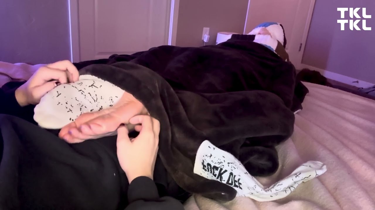 Tickling feet under the blanket preview