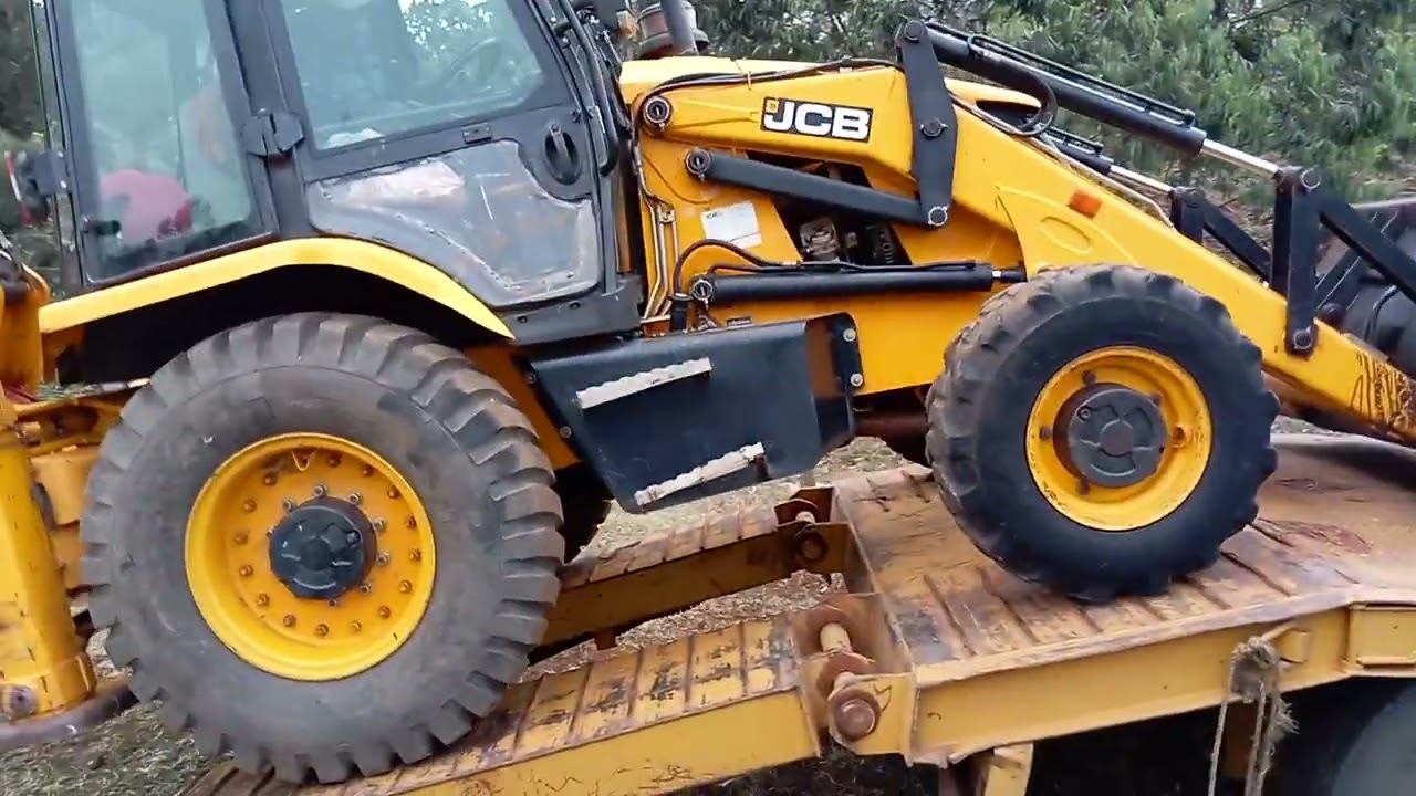 Loading a backhoe digger on a lowbed truck.  #excavator  #shorts