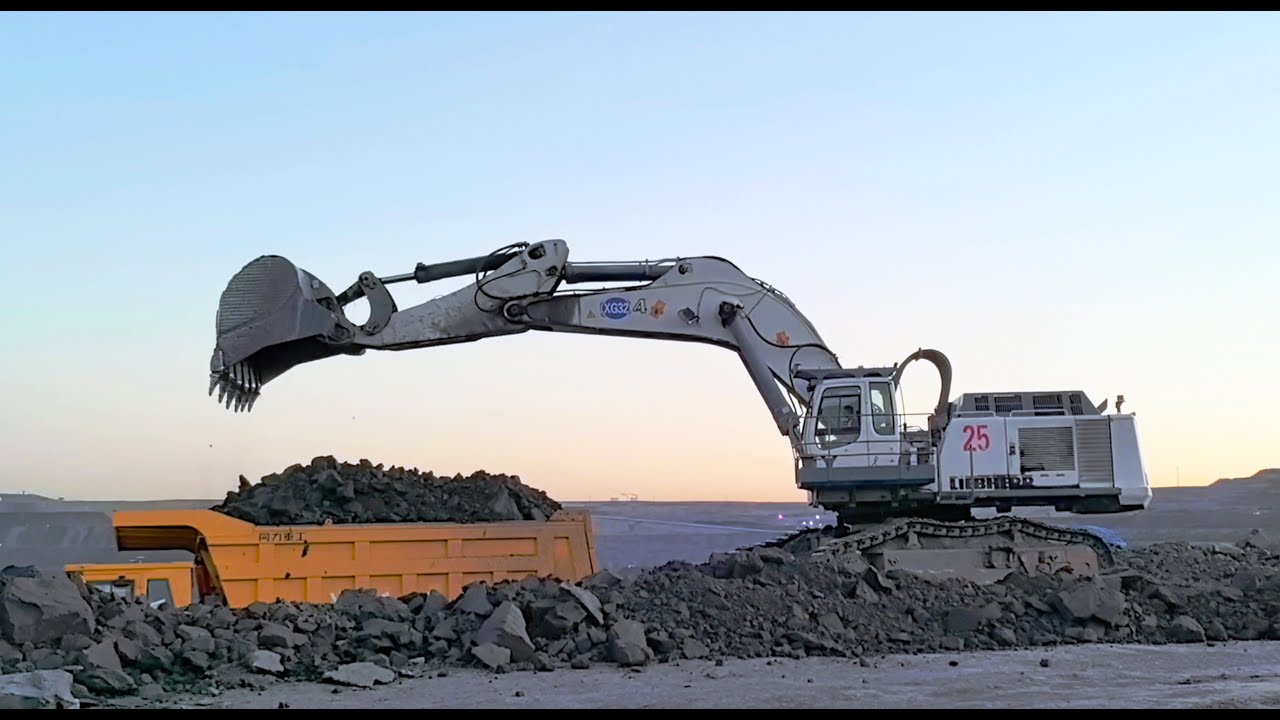 Sunset Power: Liebherr 984 Excavator Loads Dump Trucks in a Stunning Mining Scene!| Digger