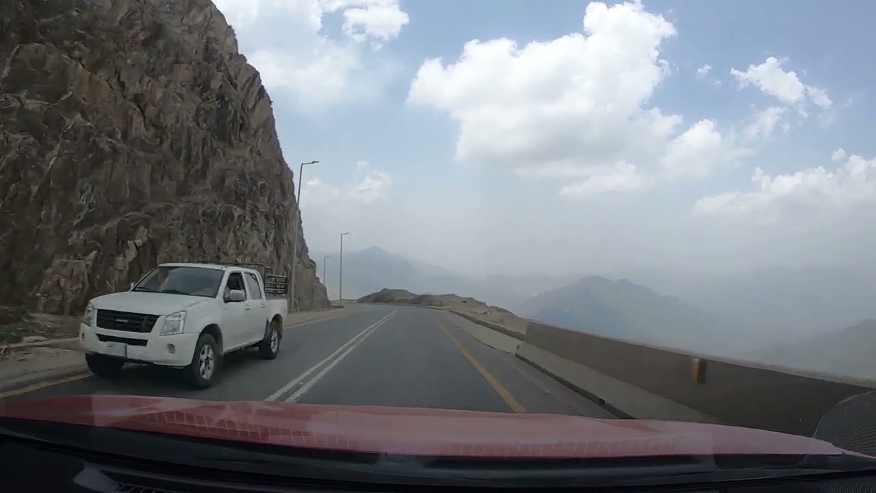 DRIVING DOWN IN STEEP AND WINDING ROAD IN ABHA, ASIR REGION, KINGDOM OF SAUDI ARABIA
