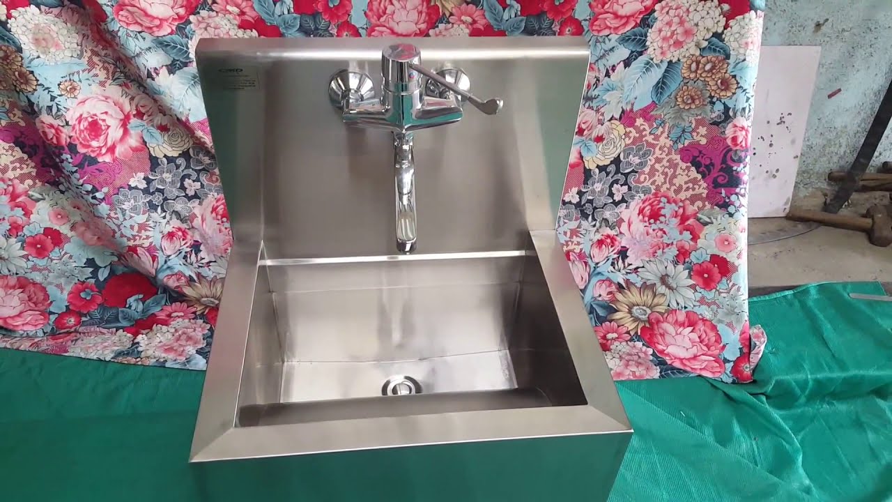 1000 - WALL MOUNTED SCRUB SINK ELBOW OPRETED
