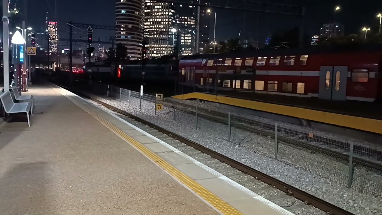 Vossloh JT42BW takes a Stuck train in Tel Aviv Center.