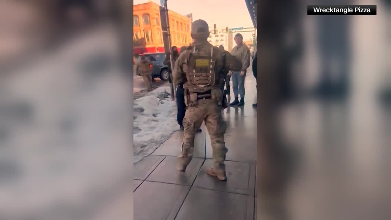 ICE agents and protesters clash outside Minneapolis pizza restaurant
