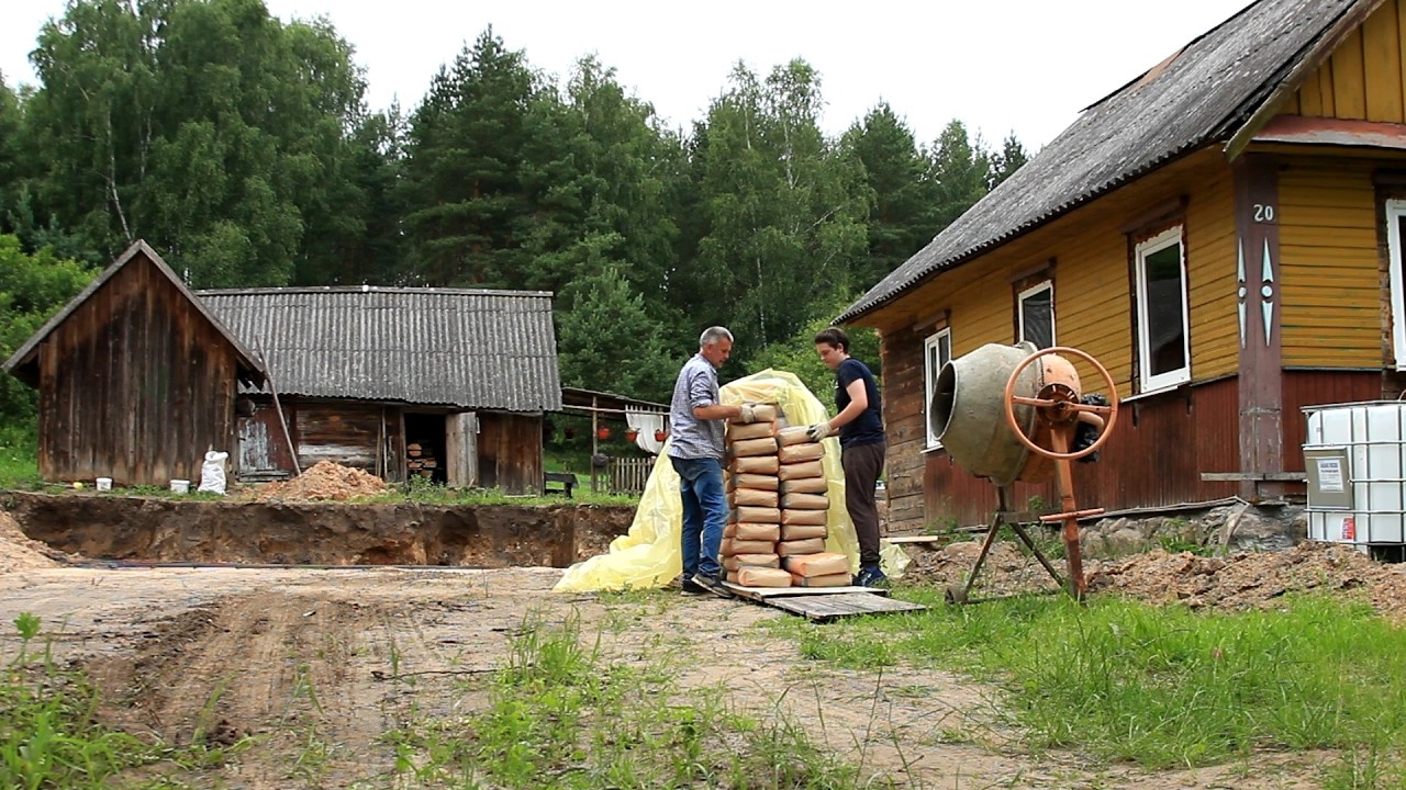 Renovation of an old house. Preparing a load-bearing wall for the terrace. Laying a sewer system