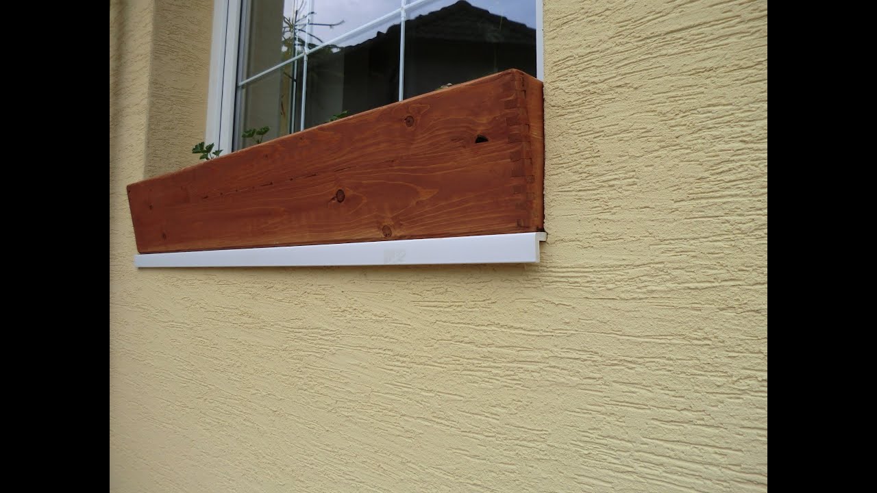 wooden window box to prevent plants from tipping over