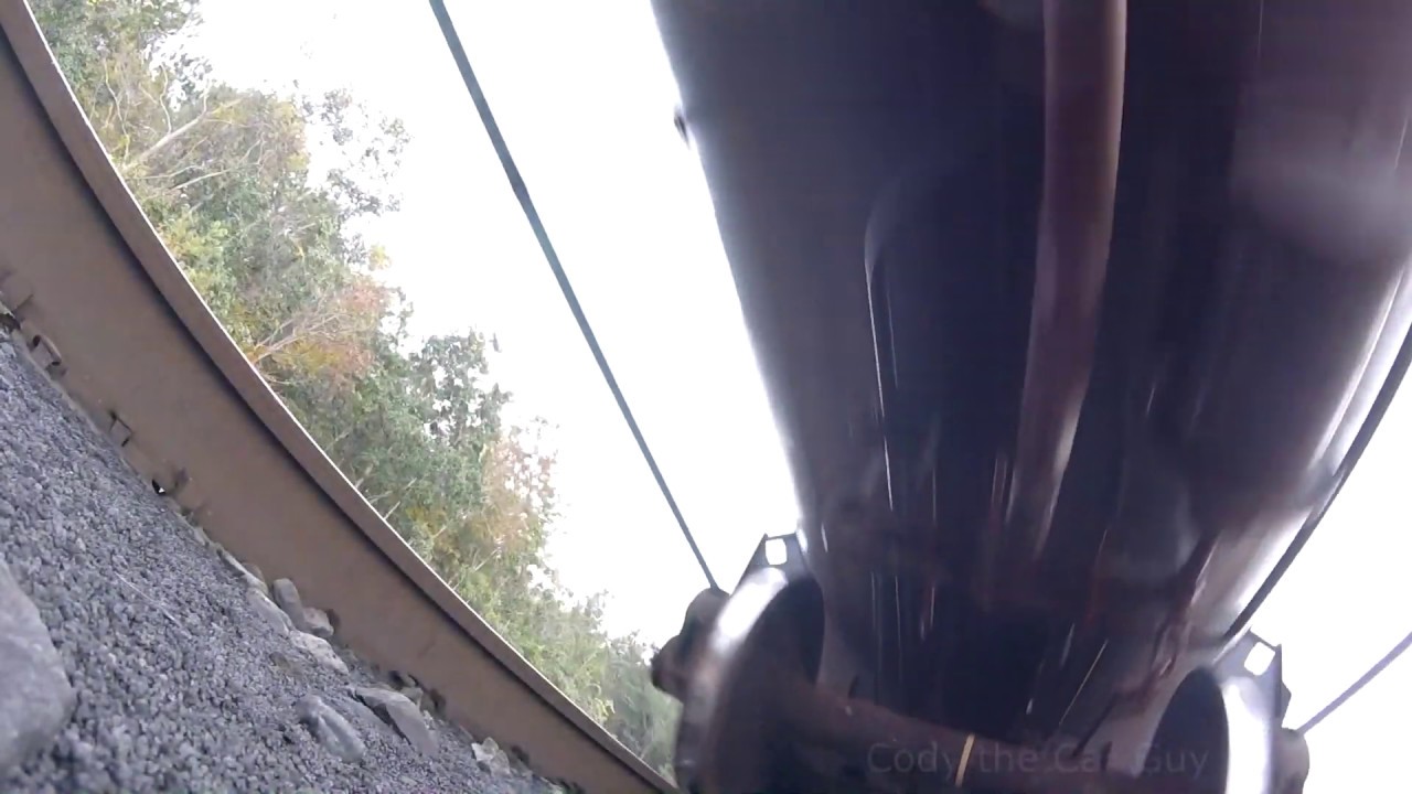Underneath view of train in  motion.