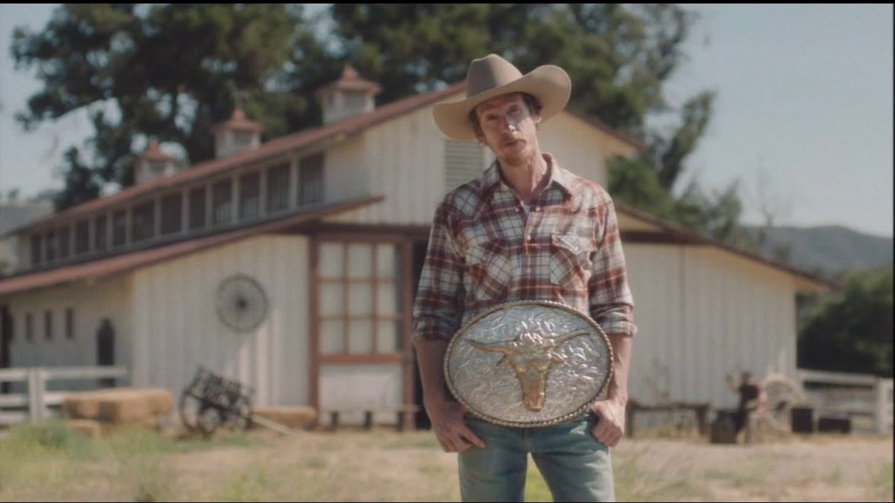 Geico cowboy belt buckle commerical 2018