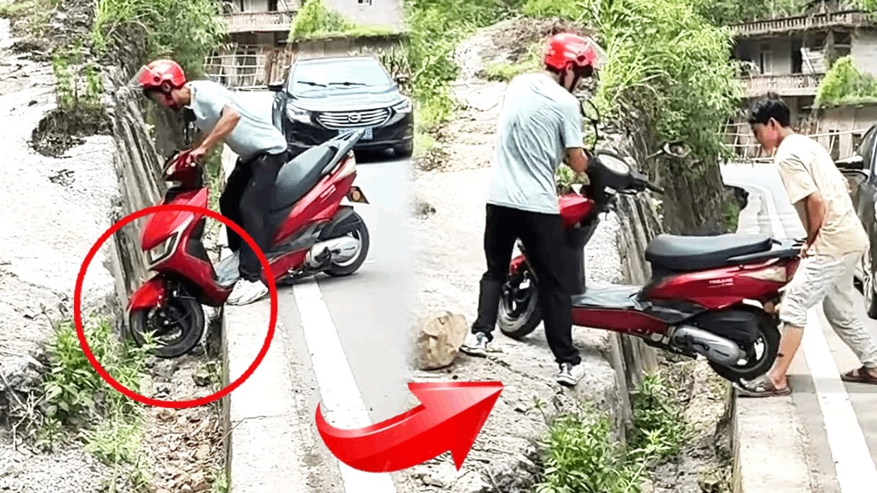 A young man's motorcycle got stuck in a ditch, and kind people helped lift it out.