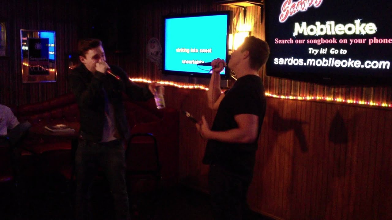 Kyle and Josh signing kareokee at sardos