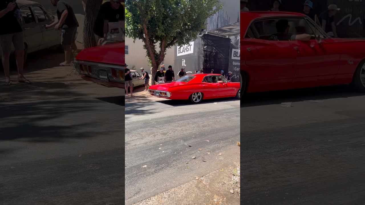 1968 Chevrolet Impala 4-door cruising Tuff Street at Summernats