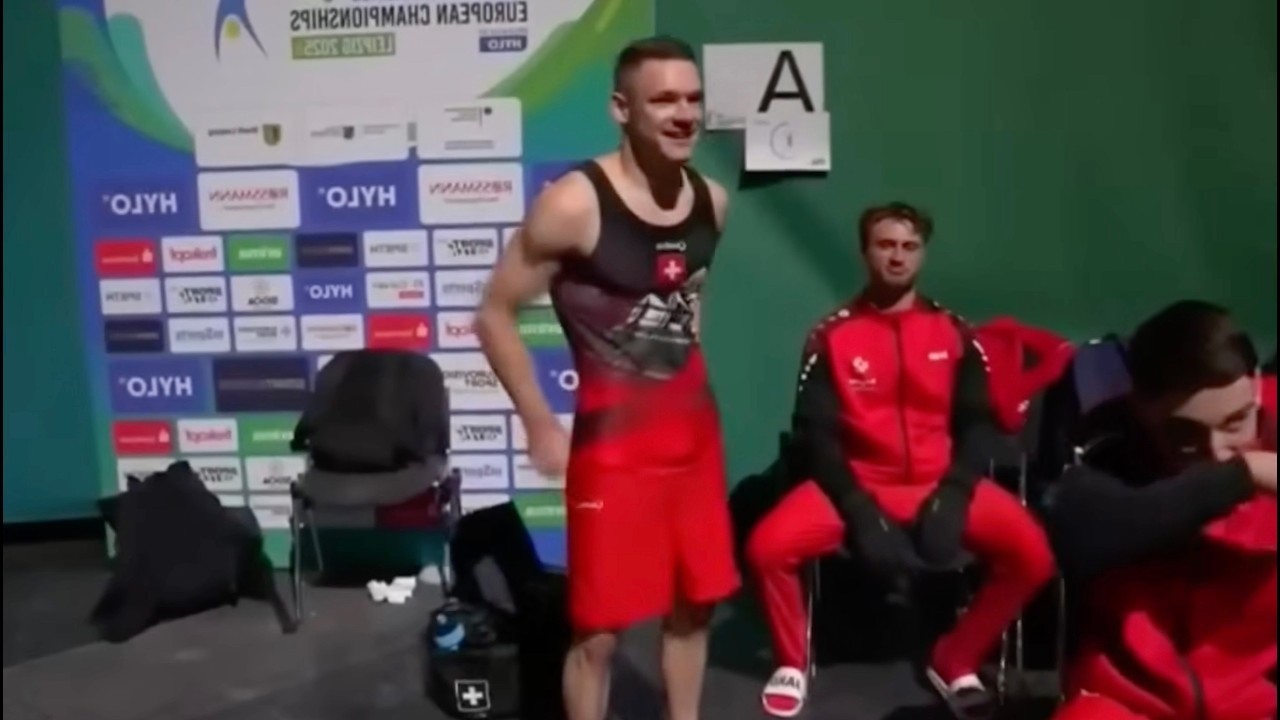 Male gymnast eats banana in Men's Quatro Gymnastics singlet