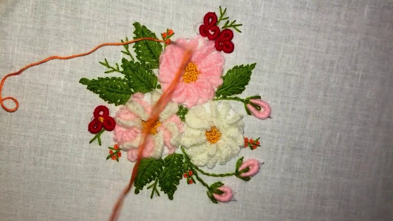 Hand embroidery/Brazilian embroidery flowers with wool/cast on stitch and rolled stitch.