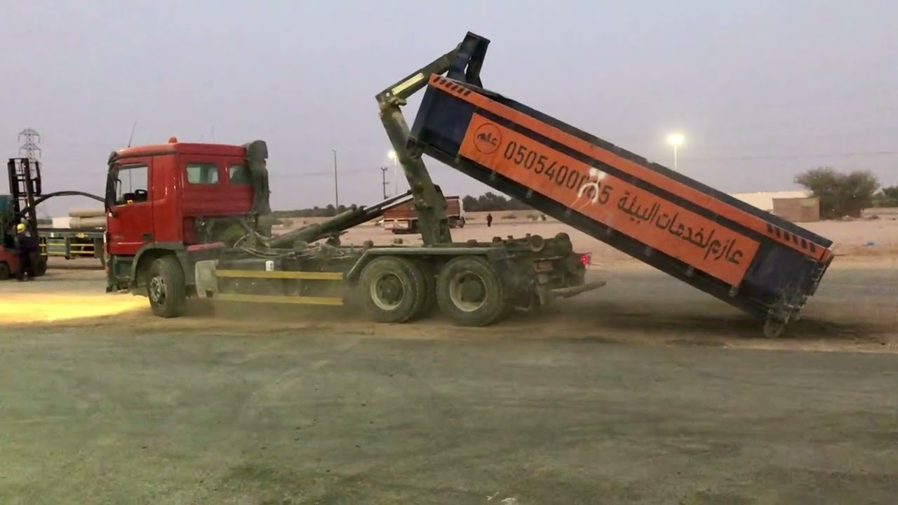 Heavy Trailer Unloading Metal Dumpster on Site. #HeavyEquipment#ConstructionLife