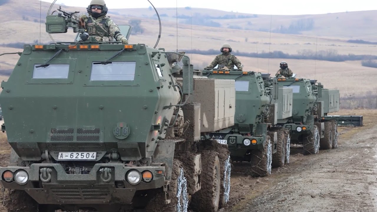 Romanian and Polish Soldiers conduct a M142 HIMARS Live Fire