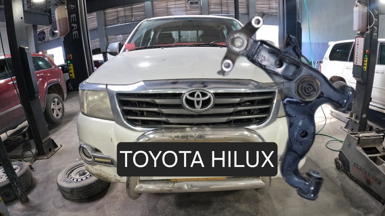 replacing lower control arm and ball joint .... toyota hilux #suspensionsystem #toyota #hilux
